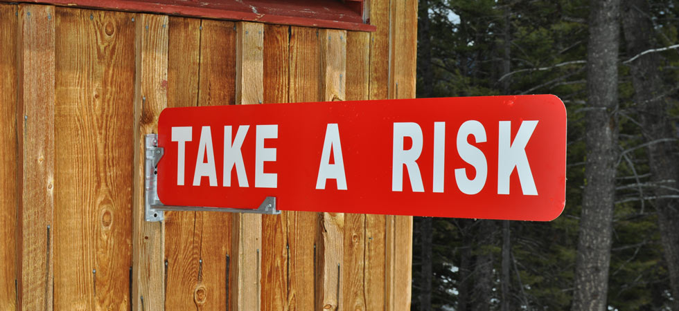 take-a-risk-motivational-sign